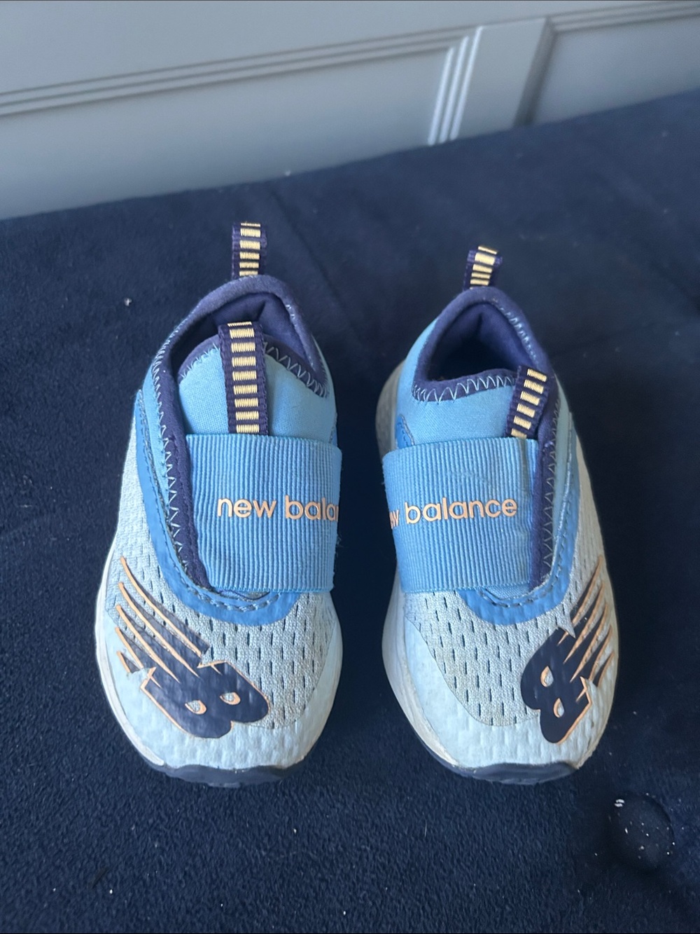 New Balance Kids Light Blue and Navy Slip-On Sneakers with Gold Accents